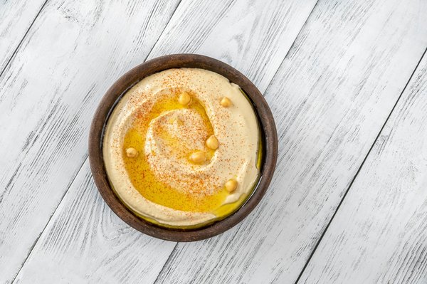 What's the Technique for a Perfectly Smooth and Creamy Hummus with Roasted Garlic?
